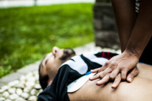 A bystander delivers hands-only CPR to someone experiencing sudden cardiac arrest.